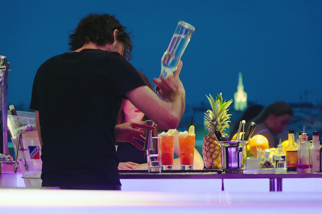 Bartender preparing a signature cocktail at an event