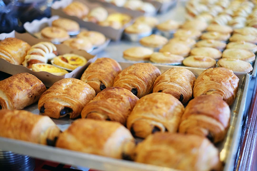 Mini croissants and fruit danishes on a catering platter