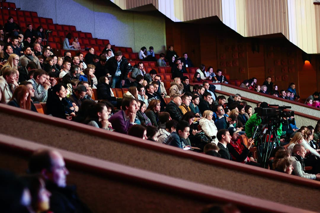 Professional barista serving conference attendees